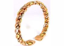 A flattened entwined design made from Copper, brass and a small amount of aluminum to give an attractive three colour look, contains two rare earth magnets